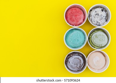 Top View Ice Cream Flavors In Cup On Yellow Blackground