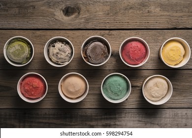 Top View Ice Cream Flavors In Cup On Blackground