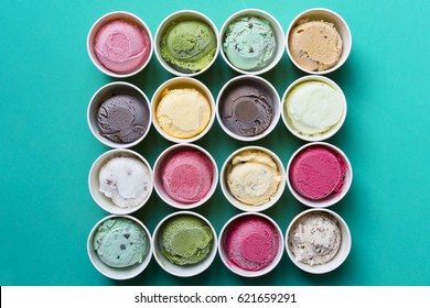 Top View Ice Cream Flavors In Cup On Green Background