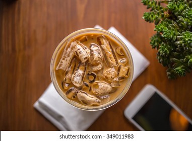 Top View Of Iced Coffee On Wooden Table