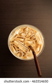 Top View Iced Coffee On Brown Wooden Table