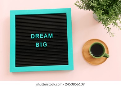 Top view image of board with the text dream big. Motivation and inspiration idea - Powered by Shutterstock