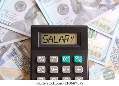 Top view image of calculator with text SALARY and money. Business and finance concept