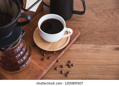 Top view image of drip coffee set on vintage wooden background