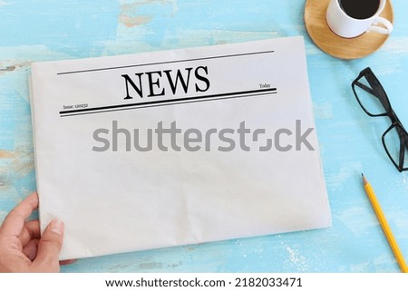 Top view image of empty newspaper over wooden table