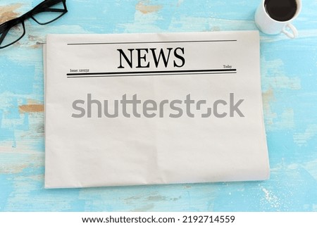 Top view image of empty newspaper over wooden table