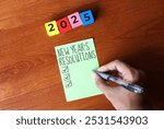 Top view image of green paper with the words "NEW YEAR