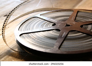 Top View Image Of Old 8 Mm Movie Reel Over Wooden Background
