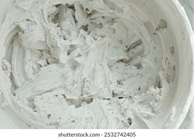 A top view image of premixed tile mortar used to adhere tiles securely to a wall or floor. 