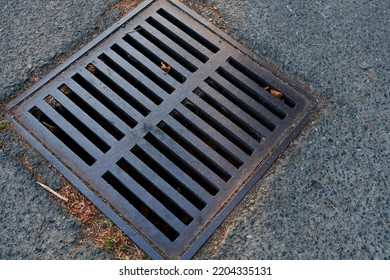 A Top View Image Of A Rusty Metal Storm Water Runoff Drain. 