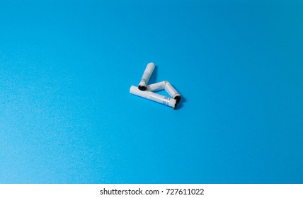 A top view image of several commercially made cigarettes.