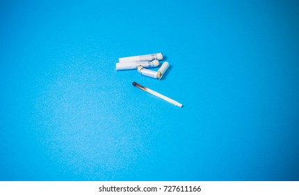A top view image of several commercially made cigarettes.