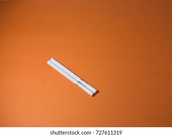 A top view image of several commercially made cigarettes.