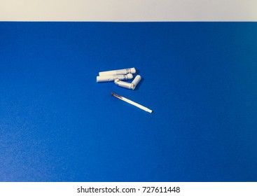 A top view image of several commercially made cigarettes.