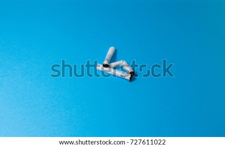 A top view image of several commercially made cigarettes.