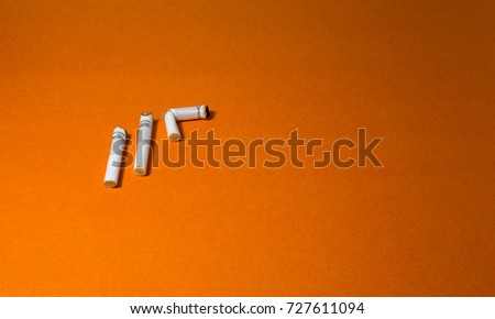 A top view image of several commercially made cigarettes.