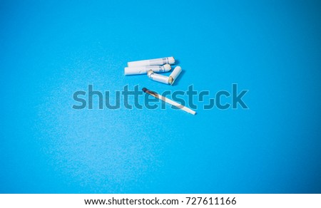 A top view image of several commercially made cigarettes.