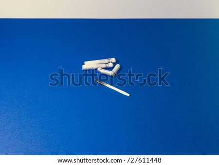 A top view image of several commercially made cigarettes.