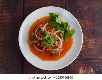 Top View Image The Spicy Salad Of Sardine With Tomato Sauce In White Dish On Wooden Table, Mixed With Herb And Lemonade, Copy Space