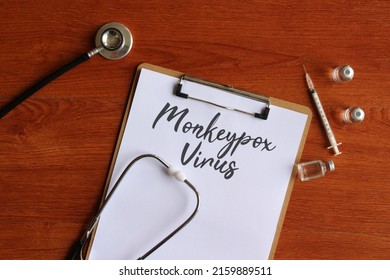 Top View Image Of Stethoscope, Glass Vial And Paper With Text MONKEYPOX VIRUS. Medical Concept.