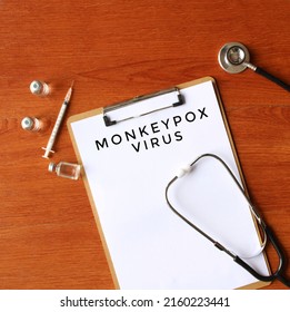 Top View Image Of Stethoscope, Glass Vial And Paper With Text MONKEYPOX VIRUS. Medical Concept.