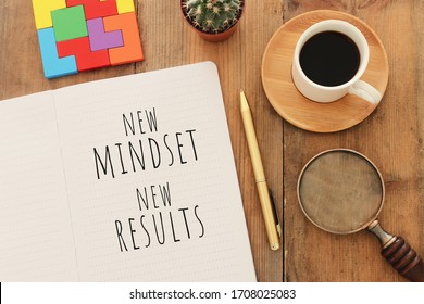 Top View Image Of Table With Open Notebook And The Text New Mindset New Results. Success And Personal Development Concept