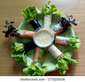 Top view image of Thai roll salad with lettuce, carrot, crab stick and seaweed eaten with wasabi mayonnaise dressing.