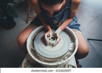 Top view Image of Unrecognizable Female Maker Ceramics Working with Eco Friendly Clay on Pottery Wheel in Own Workshop, Handcraft Art People Creative Pottery Process Authentic  - Powered by Shutterstock