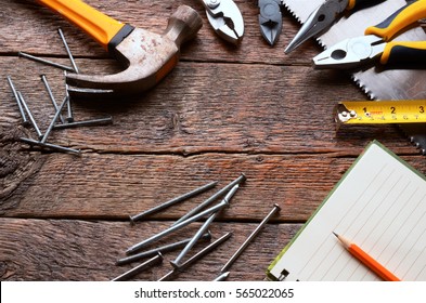 A Top View Image Of Various Hand Tools On A Wooden Work Bench.