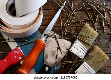 A Top View Image Of Various Small Hand Tools Used In Home Repairs And Renovations. 