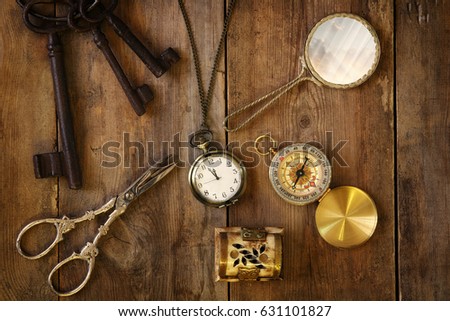 Top view image of vintage objects collection on old wooden table