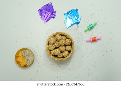 Top View Of Indian Sweet Til Ladoo With Miniature Kites And Reel 