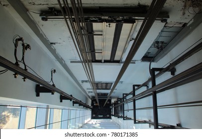 The top view inside elevator shaft,Lift Car, inside elevator, Wire Rope cable control the elevator, blur broom on Lift Car.