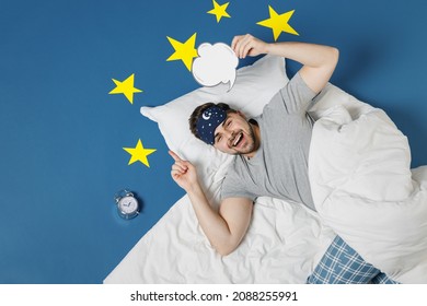 Top View Insighted Young Man In Pajamas Jam Sleep Mask Rest At Home Lies Cover Under Blanket, Blank Say Cloud Speech Bubble Content Isolated On Dark Blue Sky Background Good Mood Night Bedtime Concept