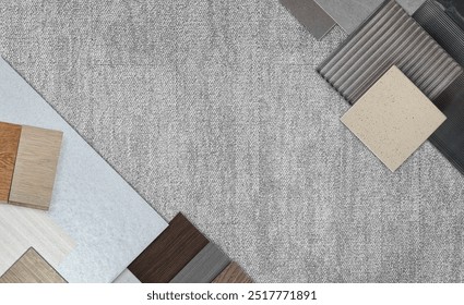 top view of interior material samples board contains ash vinyl flooring tile, stone ceramic tiles, interior fabric wallpapers, wooden laminated flooring placed on grey fabric carpet floor.