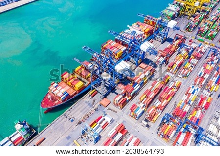 Top view of International Container ship loading, unloading at sea port, Freight Transportation, Shipping, Nautical Vessel. Logistics, import export, oversea Transportation. Global transport business.