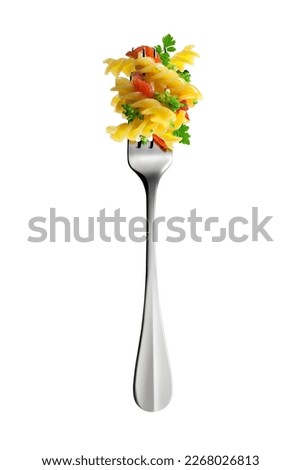 Top view of Isolated Fork with fusilli pasta broccoli tomatoes and aromatic herbs on white background