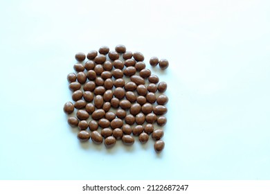 Top View Of An Isolated Group Of Chocolate Covered Peanuts