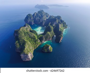 Top view of isolated rocky tropical island with turquoise water and white beach. Aerial view of Phi-Phi Leh island with Maya Bay and Pileh Lagoon. Krabi province, Thailand.