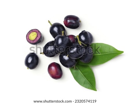 Top view of Jambolan plum with cut in half and leaves isolated on white background.