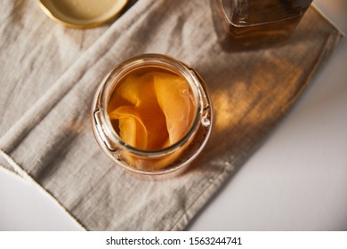 Top View Of Jar With Kombucha On Grey Napkin