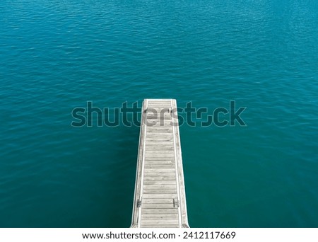 Top view of jetty over clear blue sea water