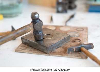 Top View Jewelry Maker Workbench With Tools On Table. Equipment And Tools Of A Goldsmith On Wooden Working Desk Inside A Workshop.