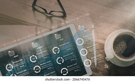 Top view Kanban board framework on virtual modern digital tablet computer showing innovation Agile software development lean project management tool for fast changes on wood desk and coffee cup. - Shutterstock ID 2066745476