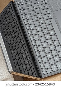 A top view of the keyboard of notebook and its reflection on the screen