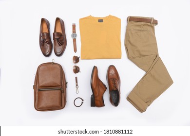 Top View Of With Khaki Pants And Accessories On White Background Flat Lay

