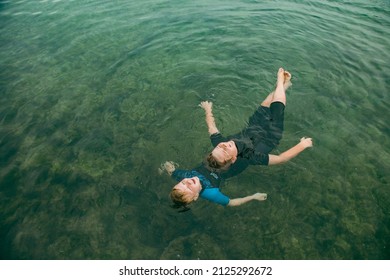 Top View Of Kids Swimming In Clear Blue Water At The Bogey Hole In Newcastle, New South Wales Australia