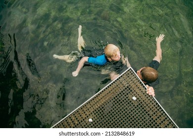 Top View Of Kids Swimming In Clear Blue Water At The Bogey Hole In Newcastle, New South Wales Australia