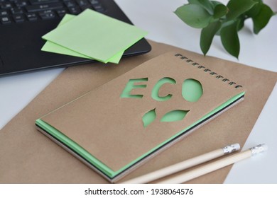 Top View Of  Kraft Notebook With Green Leaf, Keyboard. Office Eco Friendly, Home Office Desktop Organisation, Work From Home. 