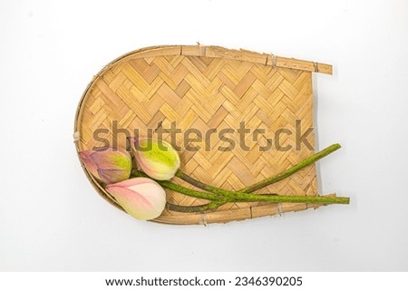 TOP VIEW  OF KULO WITH TWO LOTUS ISOLATED PN WHITE BACKGROUND.